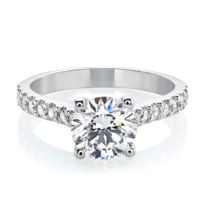 Round brilliant cut diamond ring with shared claw side diamonds