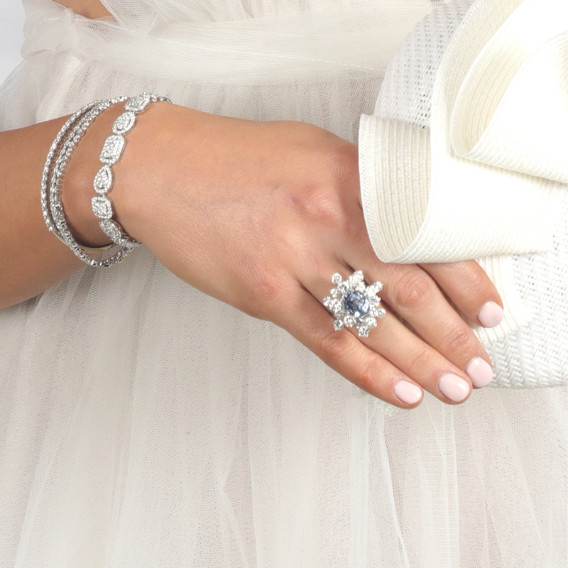 ceylon sapphire and diamond ring on hand
