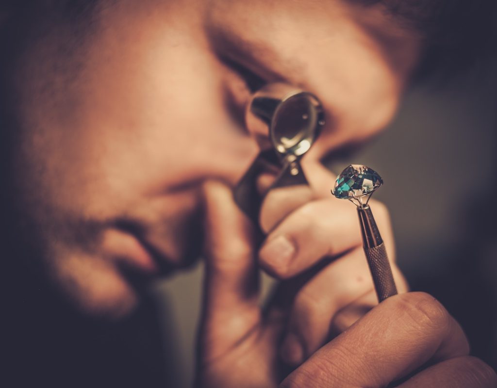 Portrait of a jeweler during gemstone identification