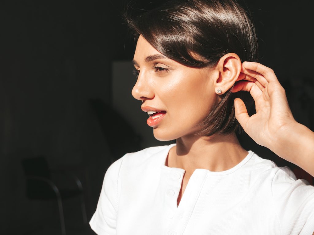 woman wearing diamond earrings