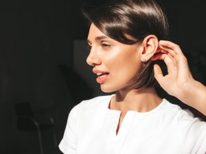 woman wearing diamond earrings