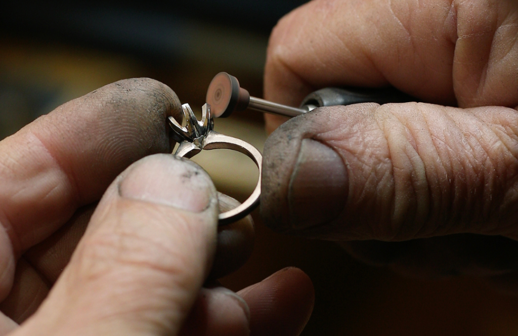 jeweller polishing a ring