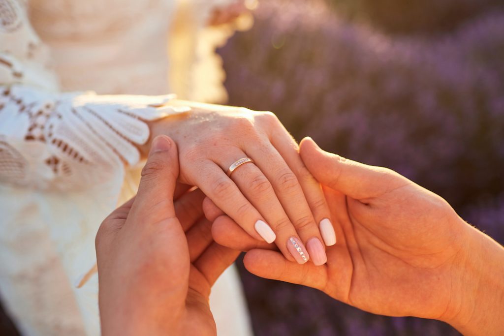 wedding ring on womans hand