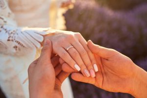 wedding ring on womans hand