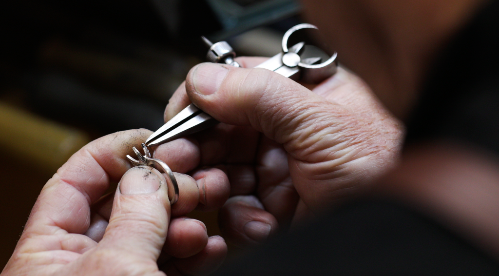 A Bell & Brunt jeweller handcrafting a custom engagement ring in the Adelaide workshop