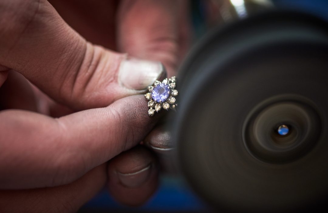 jeweller polishing a ring