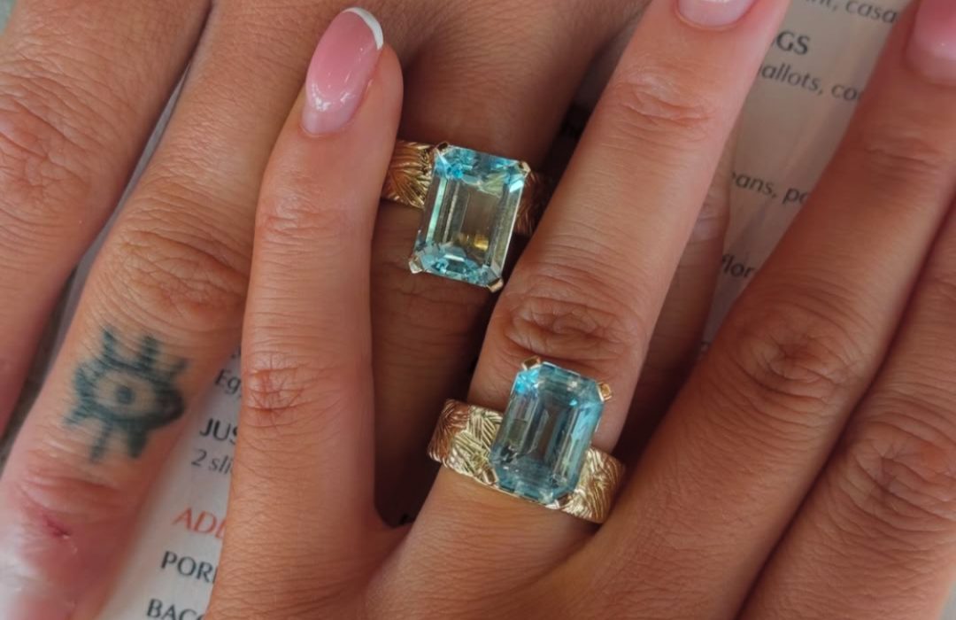 Alex and Tiffany's hands showing their engagement rings made by Bell & Brunt