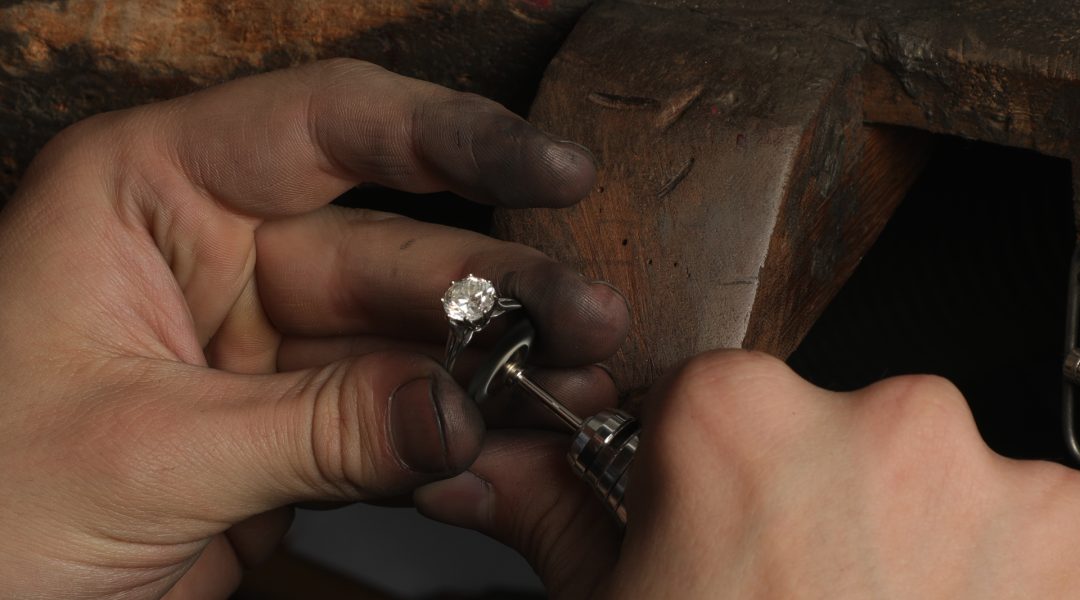 jeweller polishing ring by hand