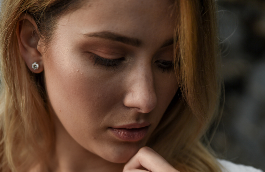 woman wearing diamond earrings