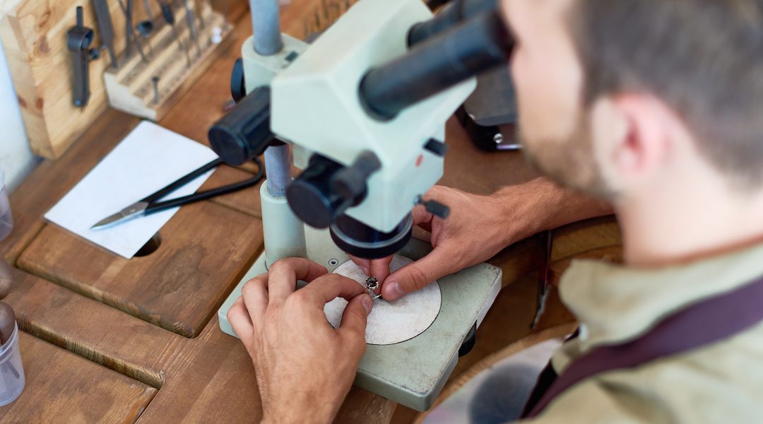 Jeweler Inspecting Precious Stone