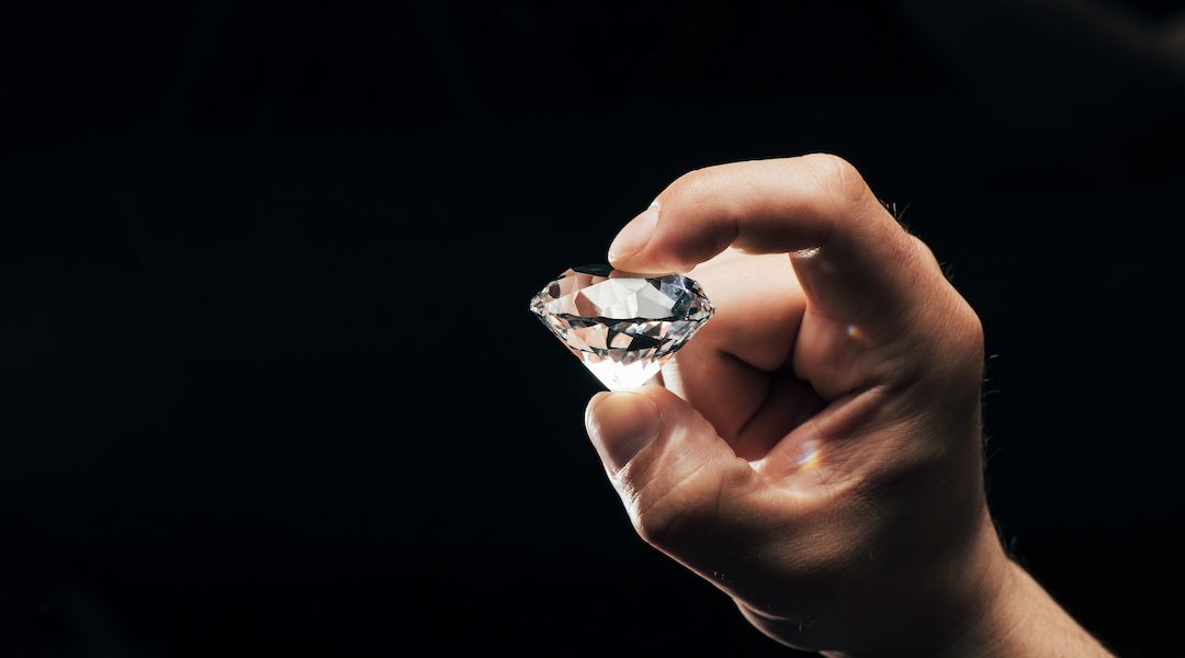 man holding diamond