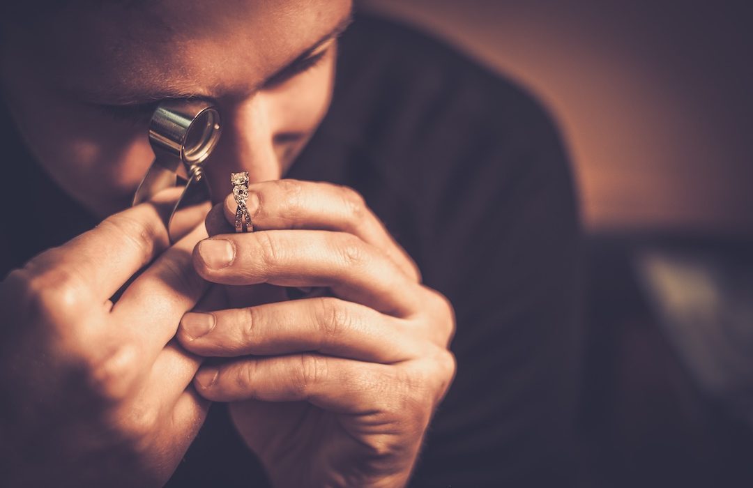 Portrait of a jeweler during the evaluation of jewels.