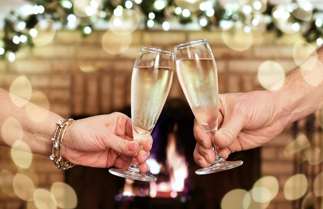 toasting-the-new-year-in-front-of-a-fire-in-a-fire-2023-11-27-04-57-59-utc