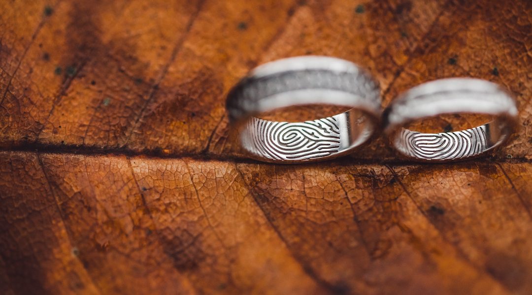 Wedding rings with fingerprints close-up