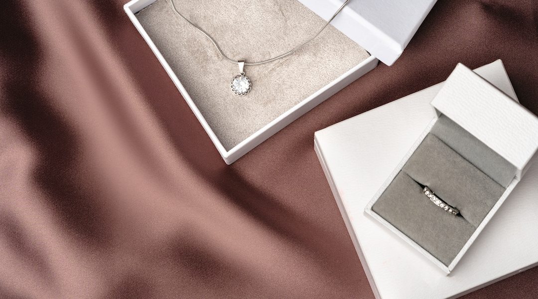 White jewelry boxes packed for travelling