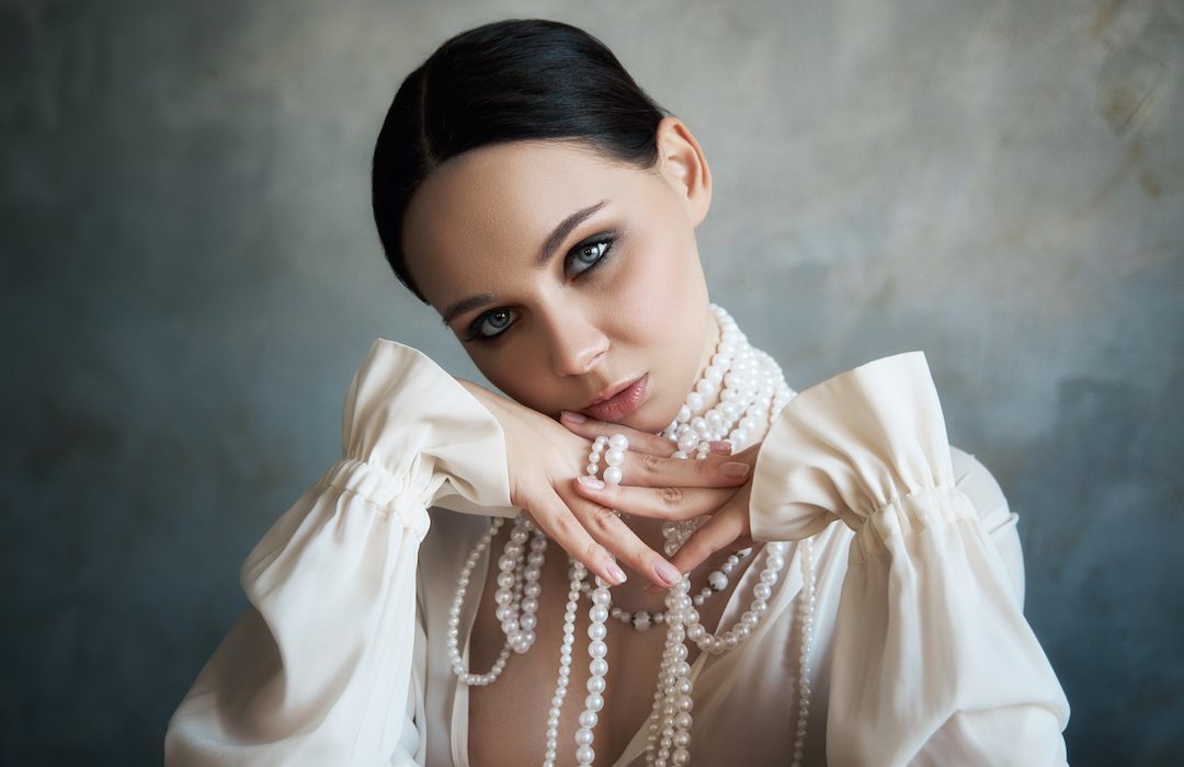 woman wearing pearl jewellery